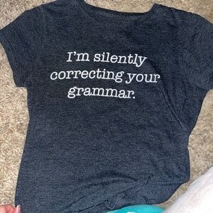 Dark grey colored tee shirt